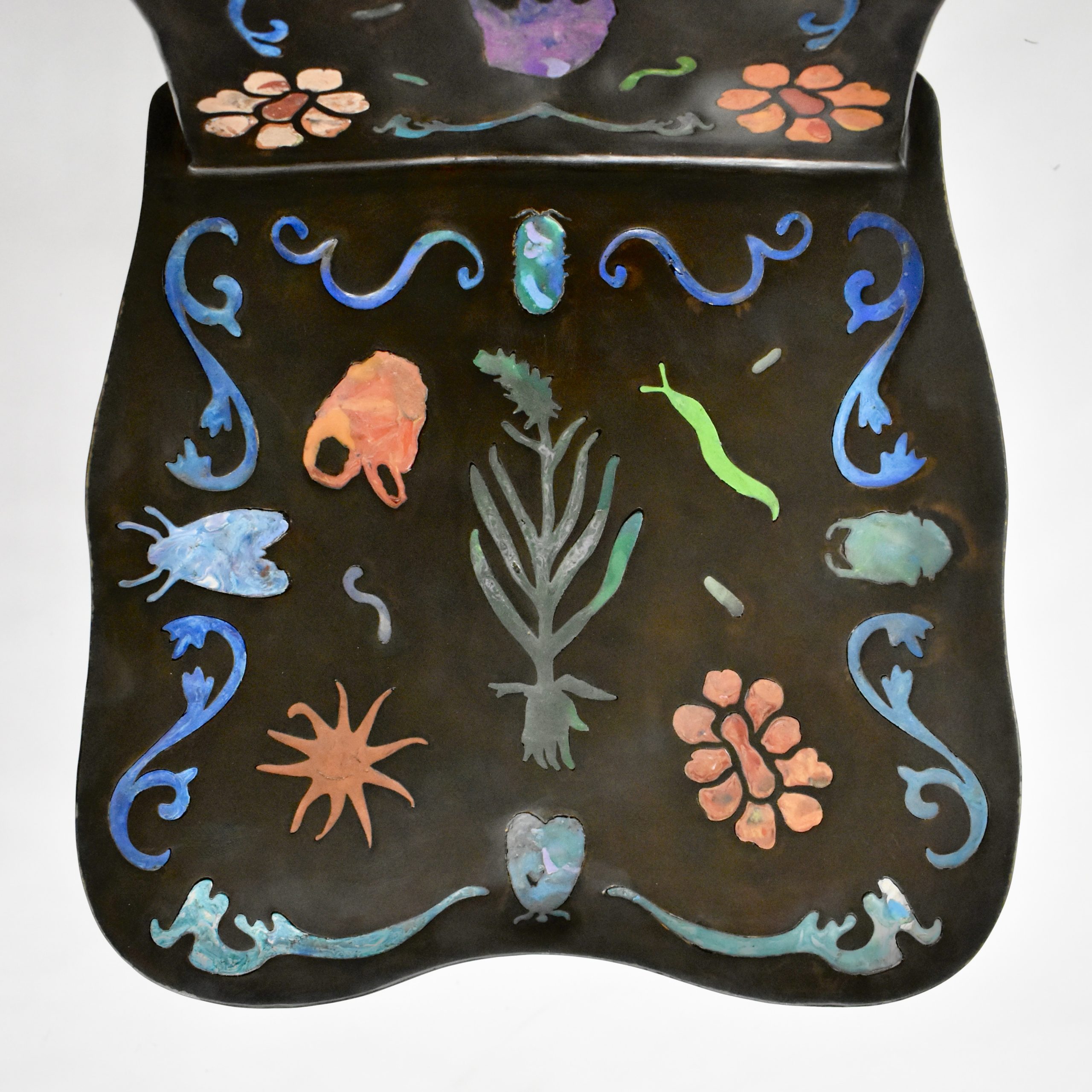 Pietra Plastica chair seat inlaid with insects, flowers and plants in melted bottle caps
