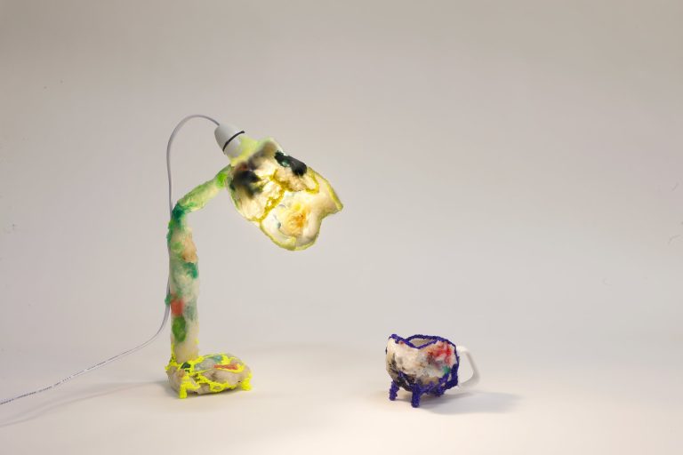 Living in the Plasticene: a lamp and a small pot made from melted domestic plastic waste