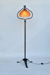 Peloria floor lamp in black steel with an orange recycled-plastic shade