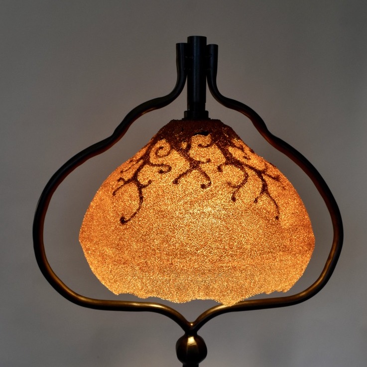 Peloria floor lamp shade by Coline Le Quenven, lit, recycled plastic in a patinated steel frame