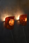 Pair of Wall Sconces by Coline Le Quenven, recycled bottle-cap plastic shades lit on a dark wall