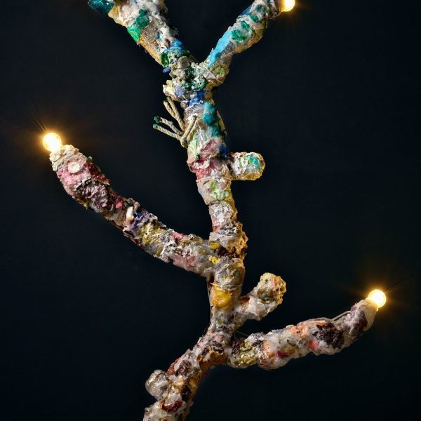 Coral lamp: a branching lamp covered in plastic fragments with bulbs at its tips